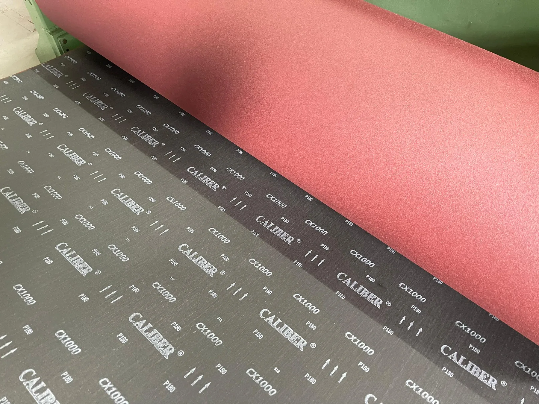 CALIBER CX 1000 coated abrasive rolls showing the abrasive face and cloth backing