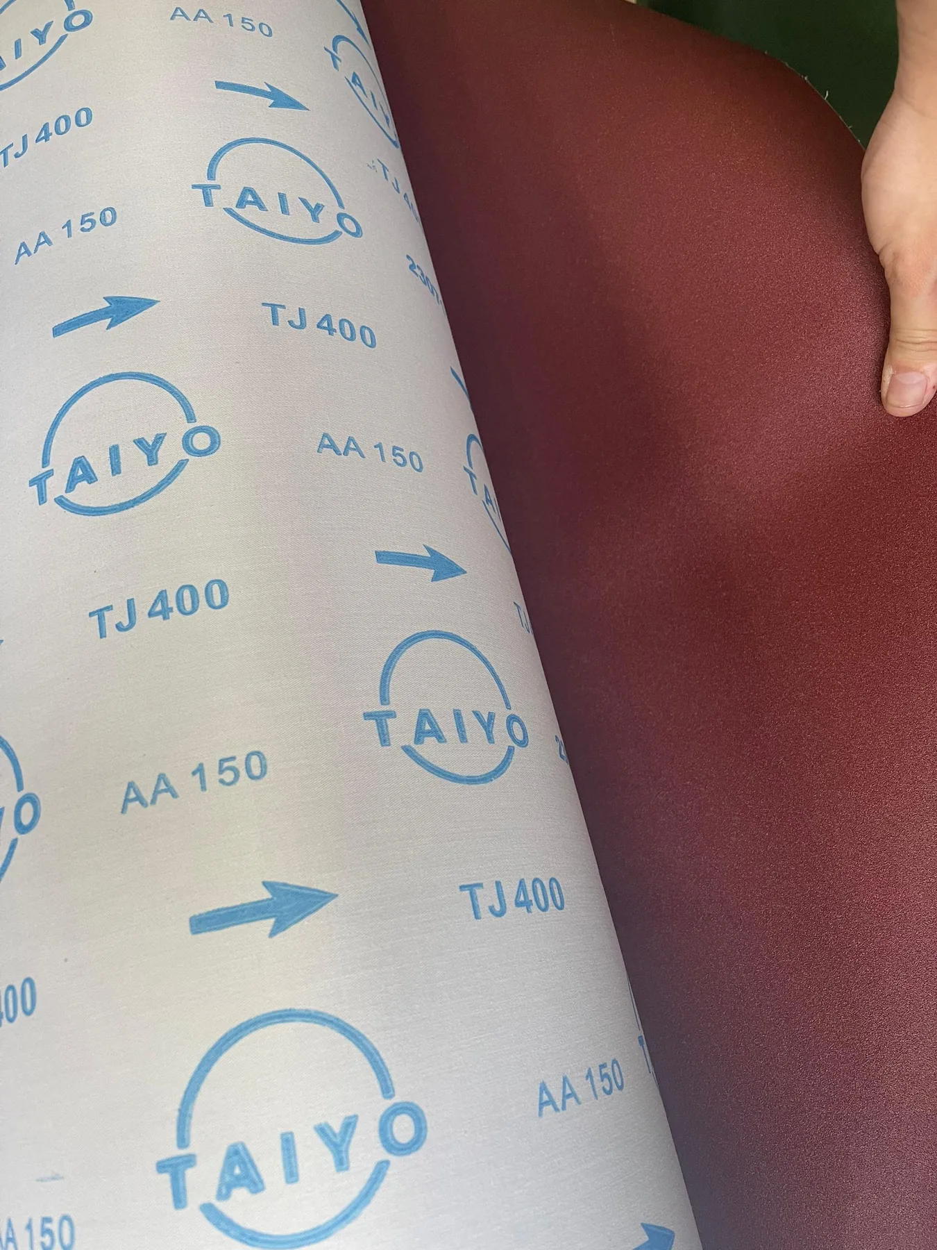 TAIYO TJ 400 abrasive sample showing the abrasive face and cloth backing
